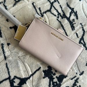 BNWT Michael Kors wristlet light pink.